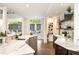 Gourmet kitchen featuring marble countertops, custom cabinets, and an open doorway to a patio at 3511 Roxboro Ne Rd, Atlanta, GA 30326