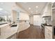Well-appointed white kitchen featuring marble counters, ample cabinet space, and stainless steel appliances at 3511 Roxboro Ne Rd, Atlanta, GA 30326