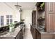 Beautiful kitchen with dark cabinets, granite countertops, and ample counter space at 3511 Roxboro Ne Rd, Atlanta, GA 30326
