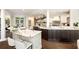 Gourmet kitchen with marble countertops, custom cabinets, and open shelving with elegant decor at 3511 Roxboro Ne Rd, Atlanta, GA 30326