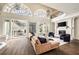 Bright and airy living room with large windows, fireplace, and staircase view at 3511 Roxboro Ne Rd, Atlanta, GA 30326