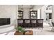 Living room featuring built in bar with chandelier lighting and a fireplace at 3511 Roxboro Ne Rd, Atlanta, GA 30326