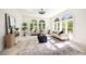 Living room featuring large windows, light colored furniture and tile floors at 3511 Roxboro Ne Rd, Atlanta, GA 30326