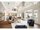 Bright open concept home with soaring ceilings, bar, and modern furniture at 3511 Roxboro Ne Rd, Atlanta, GA 30326