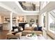 Bright living room featuring modern furnishings, stylish decor, and a decorative wrought iron balcony at 3511 Roxboro Ne Rd, Atlanta, GA 30326