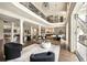 Spacious living room with soaring ceilings, wrought iron balcony, and an open layout with a modern aesthetic at 3511 Roxboro Ne Rd, Atlanta, GA 30326