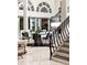 Stylish living room features stairs, a dining area, and bright, natural light at 3511 Roxboro Ne Rd, Atlanta, GA 30326