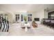 Bright living room featuring tile floors, fireplace, bar, and access to the outdoors at 3511 Roxboro Ne Rd, Atlanta, GA 30326