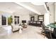Open living area featuring a bar, fireplace, and access to outdoor deck at 3511 Roxboro Ne Rd, Atlanta, GA 30326