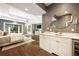 Main bedroom with hardwood floors, tray ceiling, and a beverage center at 3511 Roxboro Ne Rd, Atlanta, GA 30326