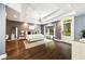 Main bedroom with hardwood floors, tray ceiling, sitting area, and an ensuite bathroom at 3511 Roxboro Ne Rd, Atlanta, GA 30326