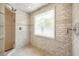 Elegant shower features subway tile surround, mosaic accents, and an art deco-style window at 3511 Roxboro Ne Rd, Atlanta, GA 30326