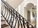 Close up of wrought iron staircase and view to an arched doorway at 3511 Roxboro Ne Rd, Atlanta, GA 30326
