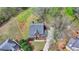 An overhead shot of a home with a well maintained front yard and long driveway at 220 Carriage Station Dr, Lawrenceville, GA 30046