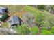 An aerial view of a brick home surrounded by trees and nearby neighborhood at 220 Carriage Station Dr, Lawrenceville, GA 30046