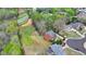 Aerial view of a traditionally styled home in a suburban neighborhood with extensive green space at 220 Carriage Station Dr, Lawrenceville, GA 30046