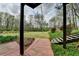 View of spacious backyard with walkway stairs leading to home at 220 Carriage Station Dr, Lawrenceville, GA 30046