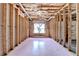 Unfinished basement featuring a large window for natural light and exposed framing at 220 Carriage Station Dr, Lawrenceville, GA 30046