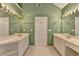 Bathroom featuring dual sinks, a vanity, mirrors, and excellent lighting at 220 Carriage Station Dr, Lawrenceville, GA 30046