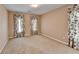 Bedroom with neutral walls, carpeted floor, and floral print curtains at 220 Carriage Station Dr, Lawrenceville, GA 30046