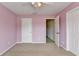 Bedroom with a ceiling fan, carpet flooring, an ensuite and a large window at 220 Carriage Station Dr, Lawrenceville, GA 30046