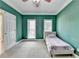 Bedroom featuring carpet flooring and two windows at 220 Carriage Station Dr, Lawrenceville, GA 30046
