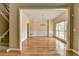 Open dining room with hardwood floors, wainscoting, and a classic chandelier at 220 Carriage Station Dr, Lawrenceville, GA 30046