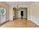 Bright dining room featuring hardwood floors and view into next room at 220 Carriage Station Dr, Lawrenceville, GA 30046