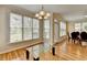 Bright dining room features hardwood floors, windows, with a view to the outdoors at 220 Carriage Station Dr, Lawrenceville, GA 30046