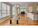 Bright and airy dining room with hardwood floors, many windows, and chandelier lighting at 220 Carriage Station Dr, Lawrenceville, GA 30046