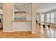 Kitchen area featuring white cabinets, wood countertops, and an open view to the breakfast area at 220 Carriage Station Dr, Lawrenceville, GA 30046
