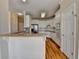 Kitchen with white cabinets, stainless steel appliances, and a peninsula counter at 220 Carriage Station Dr, Lawrenceville, GA 30046