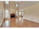 Living room featuring a fireplace, wood floors and many windows at 220 Carriage Station Dr, Lawrenceville, GA 30046