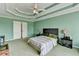 Inviting main bedroom with a ceiling fan, carpet, and many windows at 220 Carriage Station Dr, Lawrenceville, GA 30046