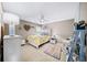 Bedroom with a white bed frame, neutral walls, ceiling fan, and beige carpet at 4215 Evans Farms Dr, Cumming, GA 30040