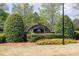 Community entrance sign surrounded by manicured landscaping, creating a welcoming and attractive first impression at 4215 Evans Farms Dr, Cumming, GA 30040