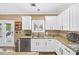 Charming kitchen with granite countertops, stainless steel appliances, and direct patio access at 4215 Evans Farms Dr, Cumming, GA 30040