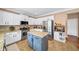 Modern kitchen featuring granite countertops, stainless steel appliances, and a functional center island at 4215 Evans Farms Dr, Cumming, GA 30040