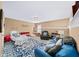 Comfortable living room featuring a cozy blue sofa, soft cushions, and a stylish blue patterned rug at 4215 Evans Farms Dr, Cumming, GA 30040