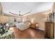 The primary bedroom is spacious with a tray ceiling and beautiful hardwood floors at 4215 Evans Farms Dr, Cumming, GA 30040