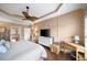 Large main bedroom boasts wood floors, a TV, and an ensuite bathroom at 4215 Evans Farms Dr, Cumming, GA 30040