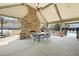 Outdoor pavilion featuring a stone fireplace and dining area, providing a comfortable space for community gatherings at 4215 Evans Farms Dr, Cumming, GA 30040