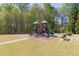 A colorful playground in a park area offers a fun play area at 4215 Evans Farms Dr, Cumming, GA 30040