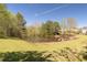Picturesque pond with green lawns and mature trees at 4215 Evans Farms Dr, Cumming, GA 30040