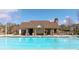 Sparkling community pool with clear water, surrounded by comfortable seating and a covered pavilion at 4215 Evans Farms Dr, Cumming, GA 30040
