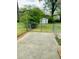 Fenced backyard with a large cement patio that is ideal for outdoor entertaining and relaxing at 4554 Saint Andrews Dr, Atlanta, GA 30331