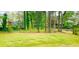 Spacious backyard with lush greenery and mature trees at 4554 Saint Andrews Dr, Atlanta, GA 30331