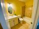 Well-lit bathroom with a single sink vanity, a toilet, and a shower-tub combo at 4554 Saint Andrews Dr, Atlanta, GA 30331