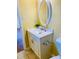 Bathroom featuring a white vanity, oval mirror, and a toilet at 4554 Saint Andrews Dr, Atlanta, GA 30331