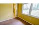 Sunlit bedroom features a neutral carpet, a window and an ensuite bathroom at 4554 Saint Andrews Dr, Atlanta, GA 30331